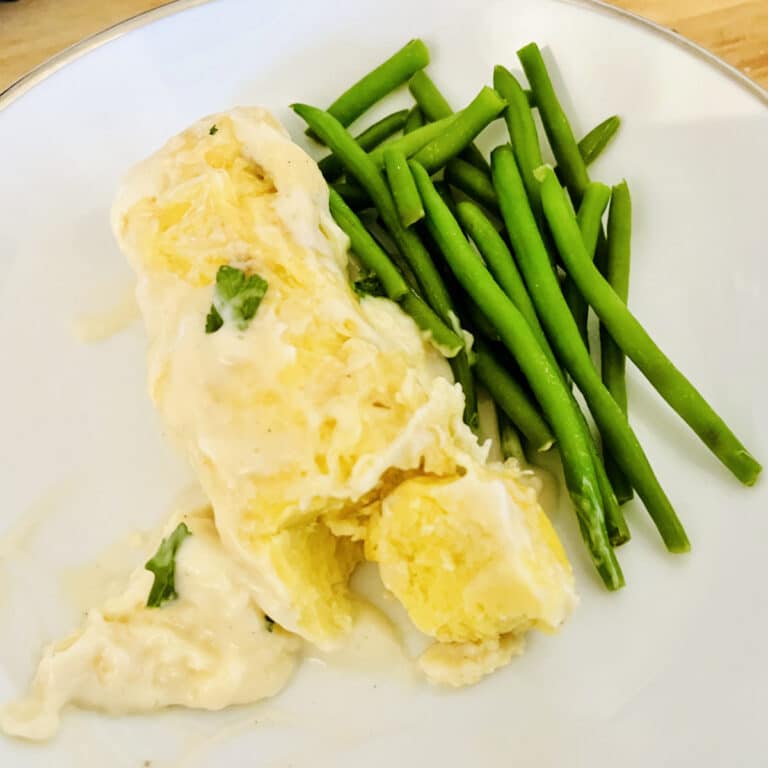 Fish quenelles in sauce