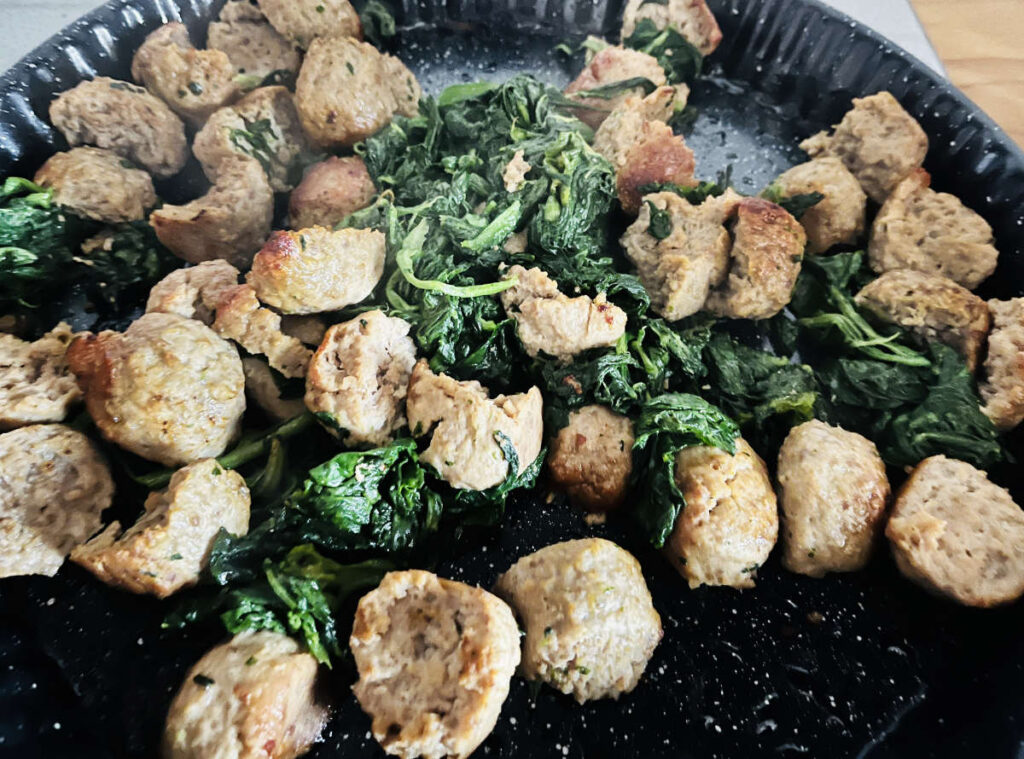 cooked meatballs with the spinach
