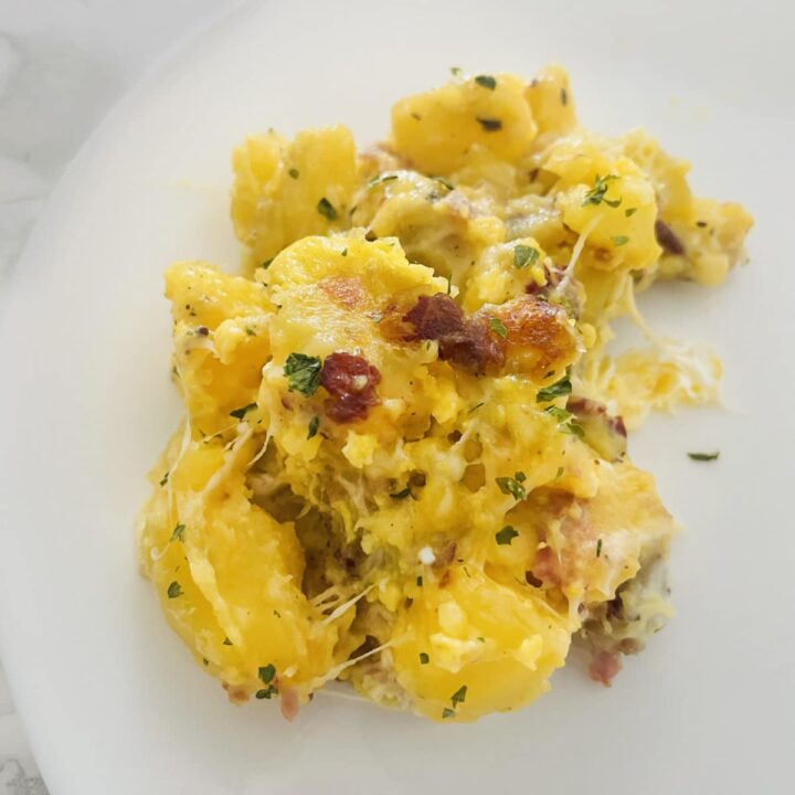 ham potato egg cheese scramble on a plate