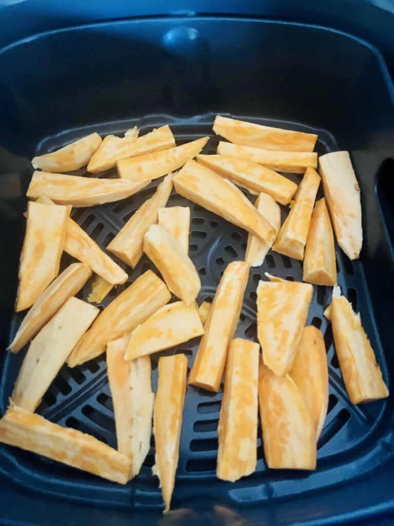 Uncooked sweet potato wedges in the air fryer