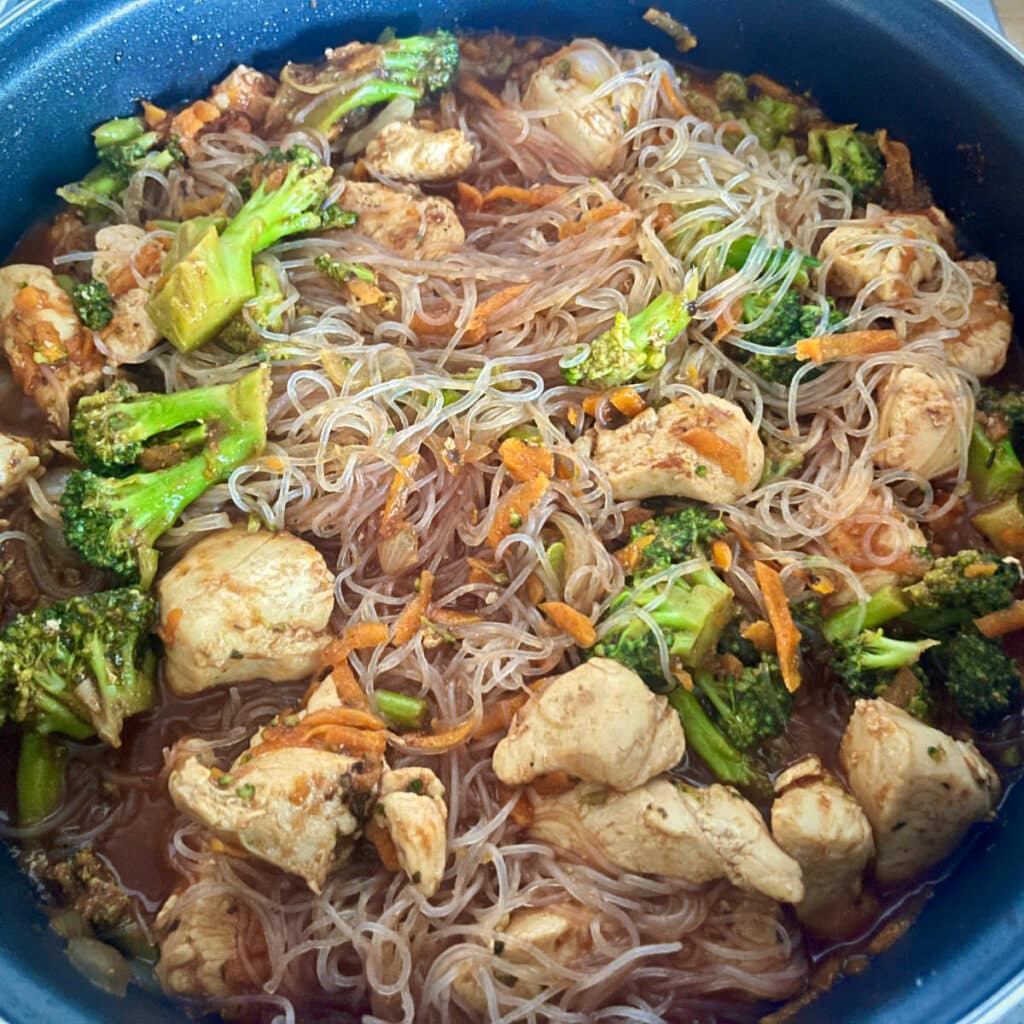 Noodles added to the chicken stir fry
