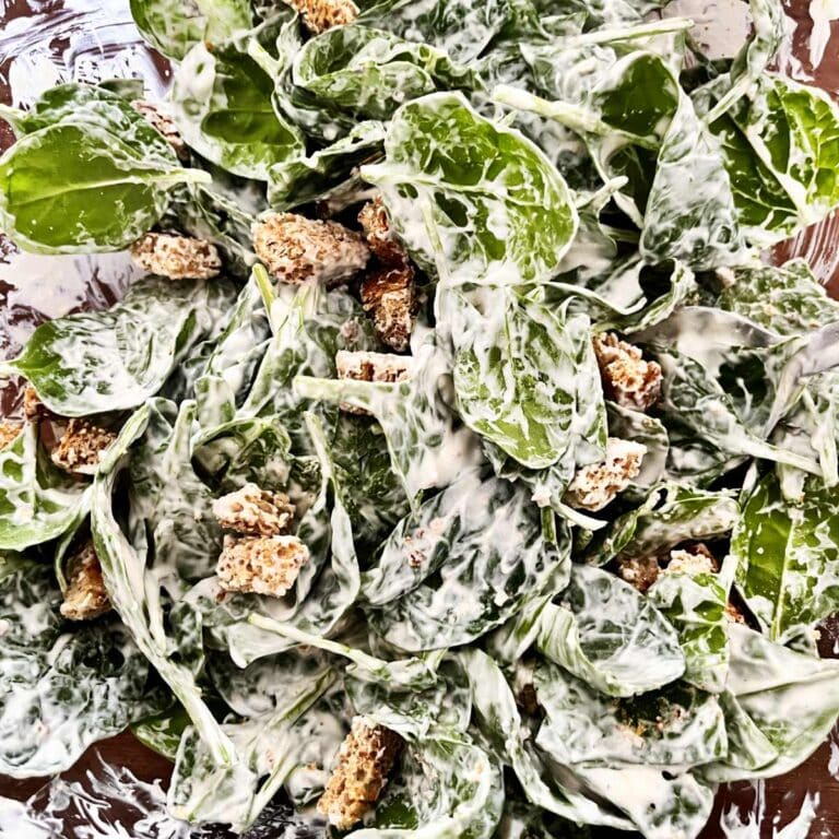 Spinach salad with tahini yogurt dressing
