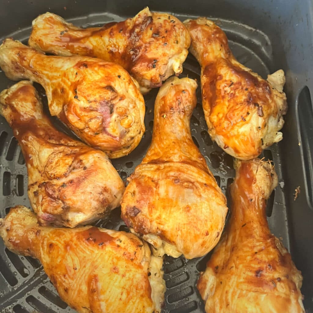 Bbq sauce added to the drumsticks in the air fryer