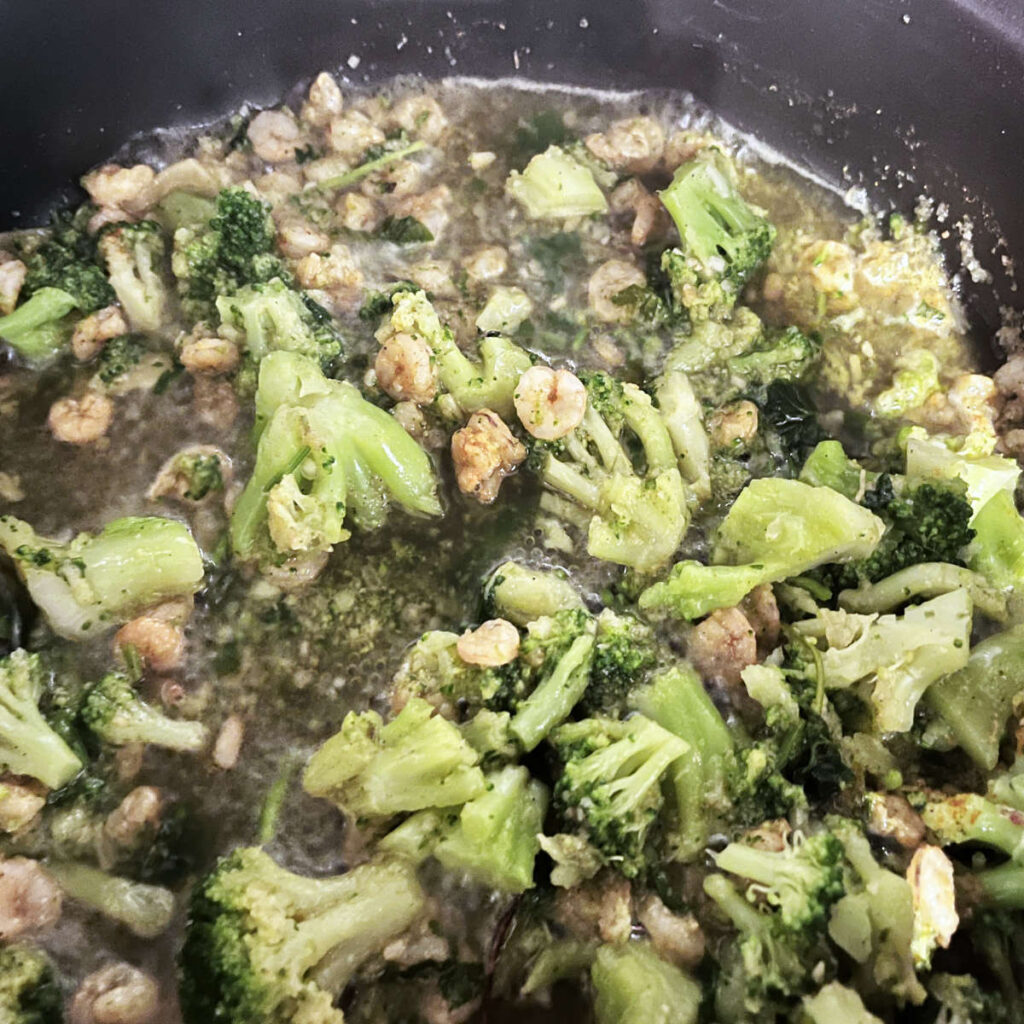shrimp and broccoli cooking on the stove