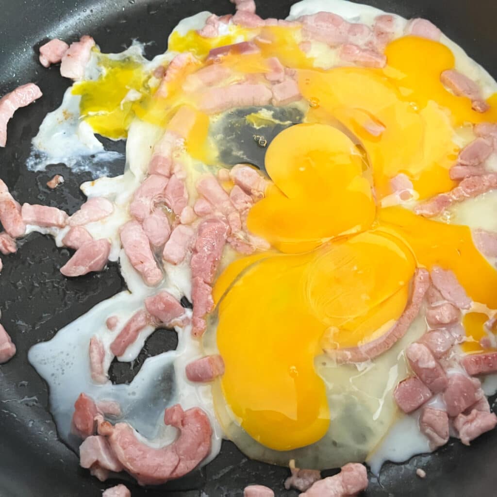 Eggs added to the bacon